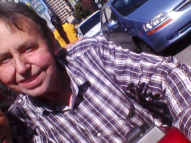 My dad in front of his house.. and my car. :)