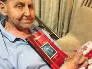 My proud poppa Robert Saulson, holding a copy of my first book "Solitude", which he kept by his bedside. Photo taken Dec. 30, 2012.
